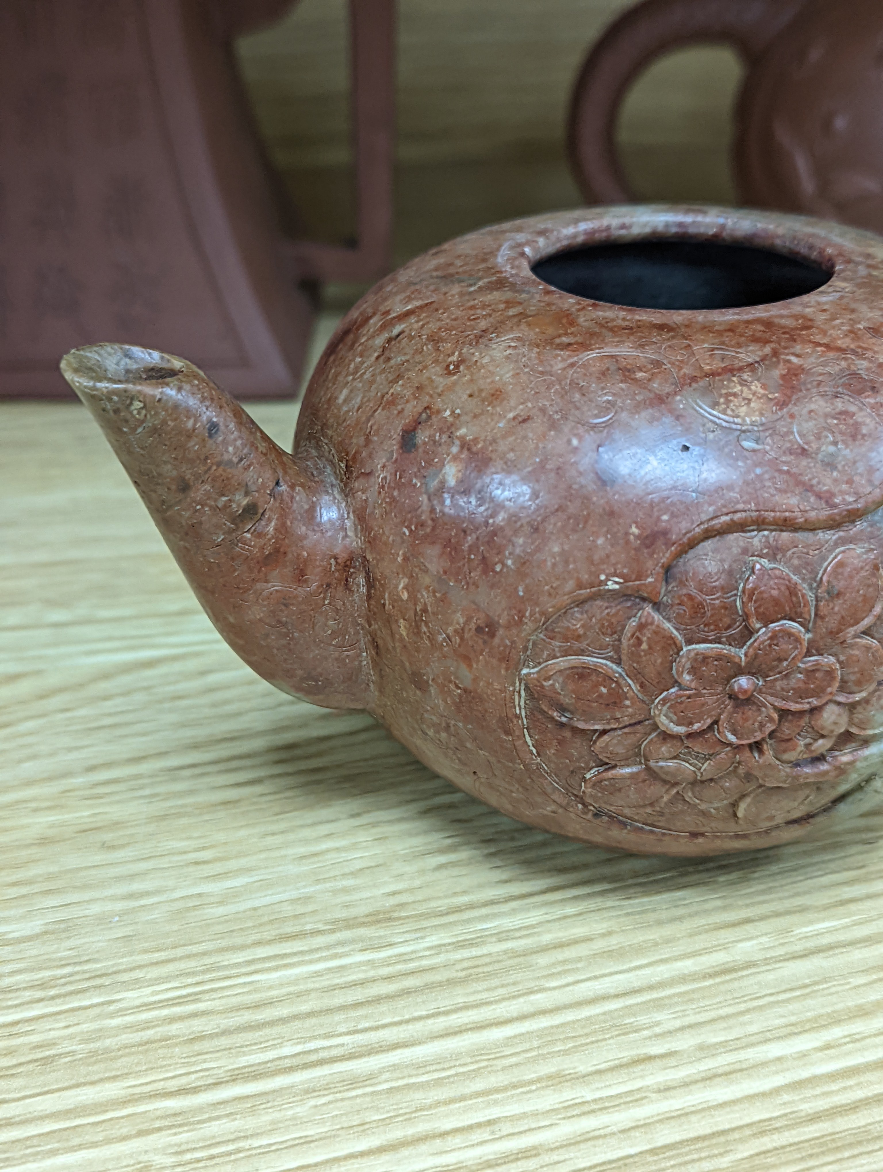 Three Chinese Yixing teapots and a carved soapstone teapot tallest 12cm